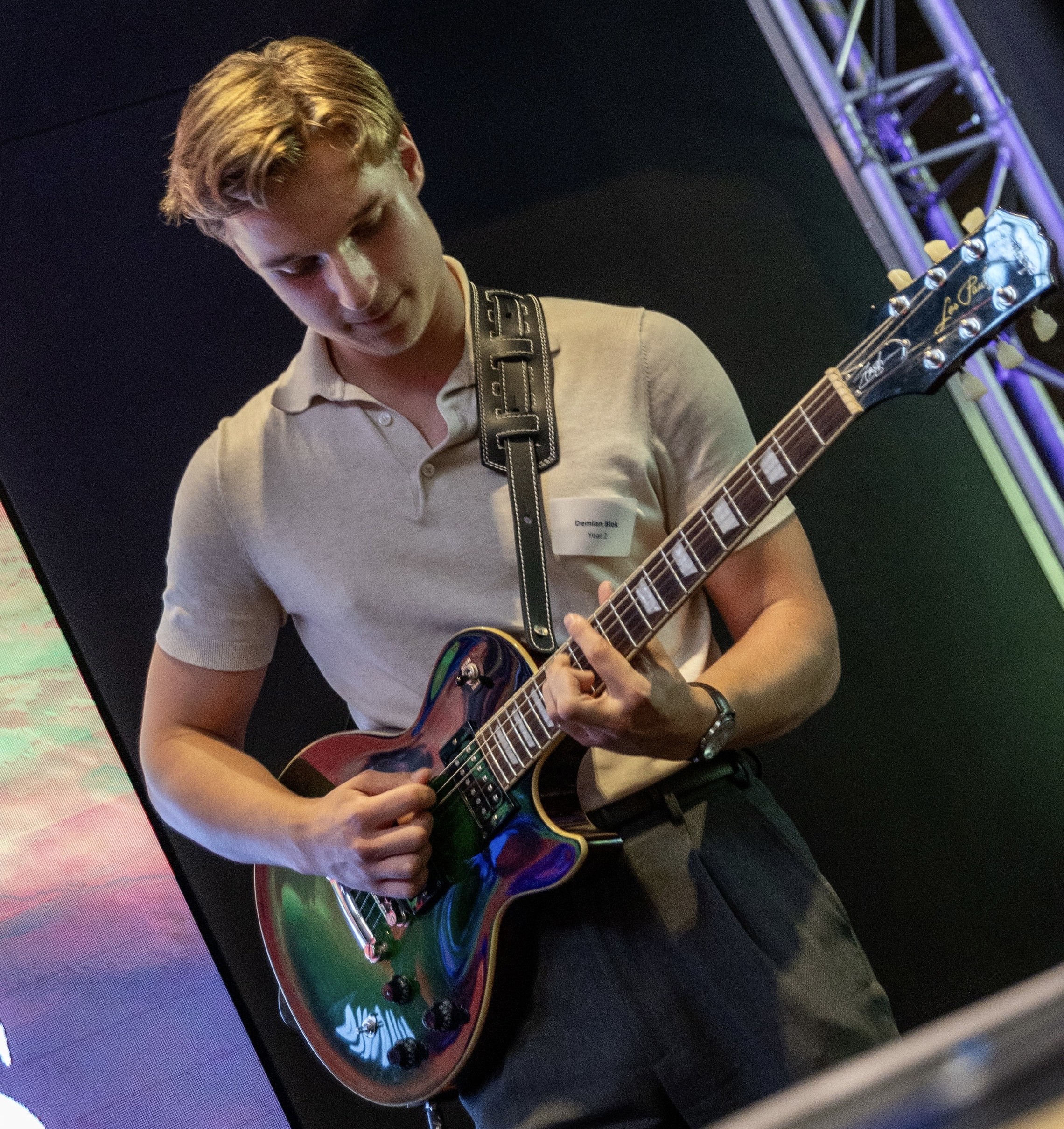 Demian playing guitar